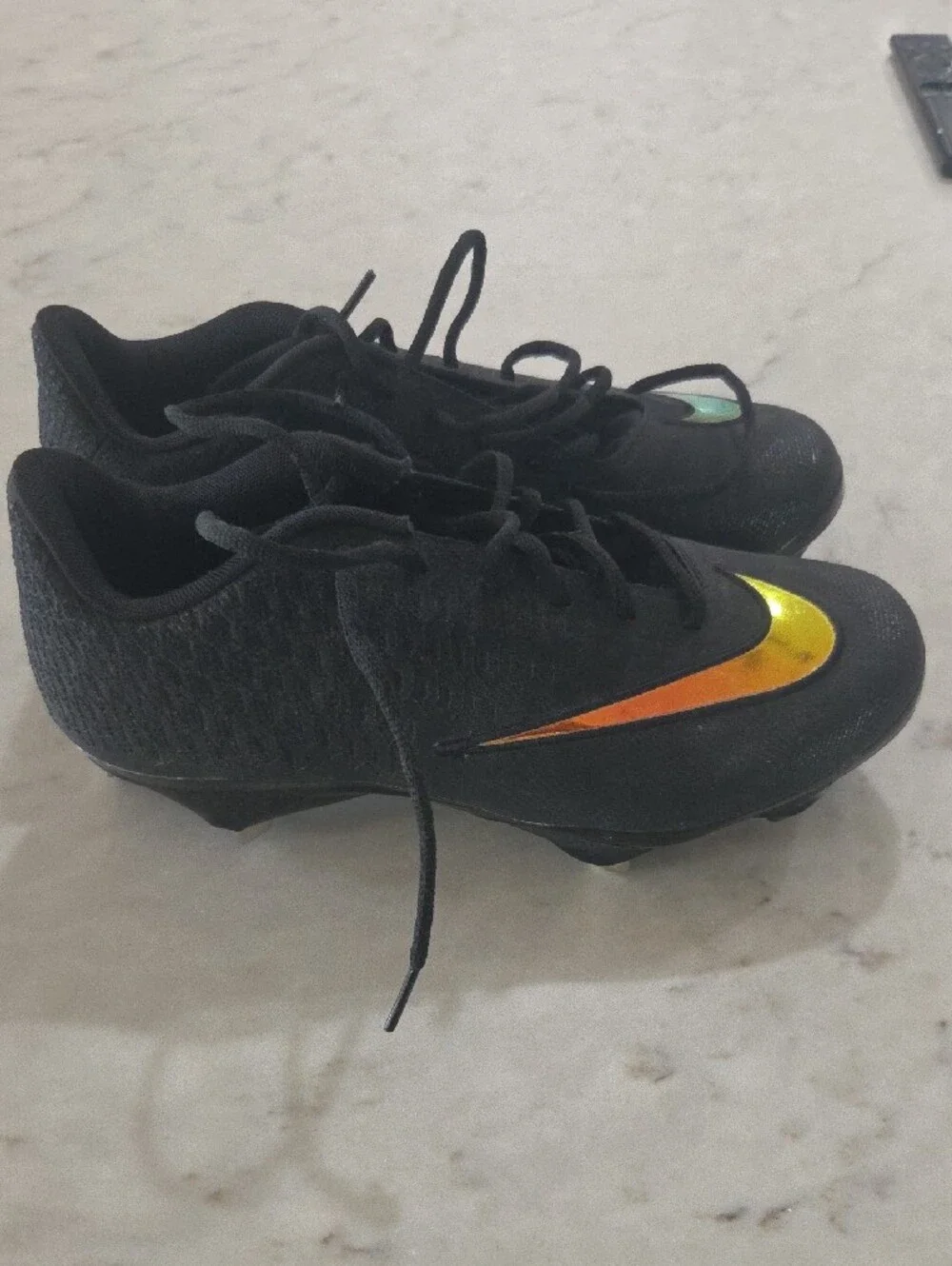 Nike Kids Black Sneakers with Orange-Yellow Swoosh